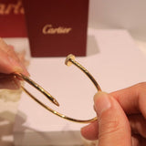 Side view of Cartier unisex jewelry piece