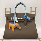 Side view of refined structured handbag