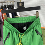 Back view of Rhude luxury clothing with monogram-inspired silhouette