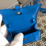 Handle and strap detail of everyday-luxe structured women's handbag – women's statement bag