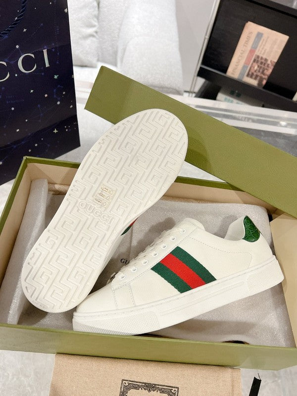 Side profile of Gucci soft grey sneakers bold athletic profile