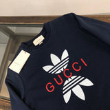Close-up detail shot of Gucci luxury clothing with relaxed-fit cut