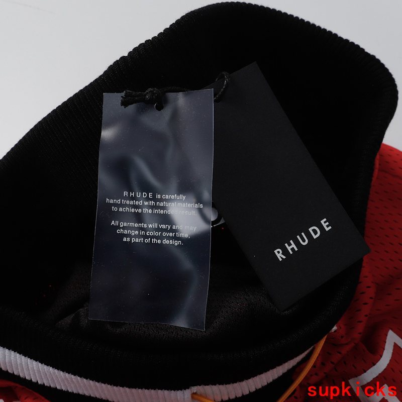 Flat lay presentation of Rhude luxury clothing with logo-detail design