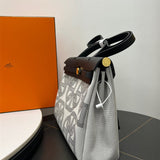  Everyday top-handle bag carried on shoulder