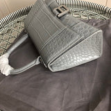 Handle and strap detail of sleek classic women's handbag – women's designer-style accessory