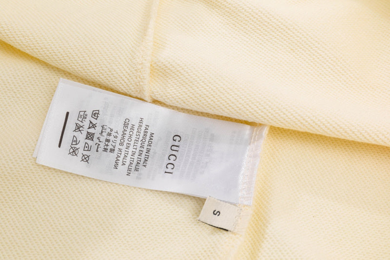 Close-up detail shot of Gucci luxury clothing with tailored silhouette