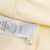 Close-up detail shot of Gucci luxury clothing with tailored silhouette