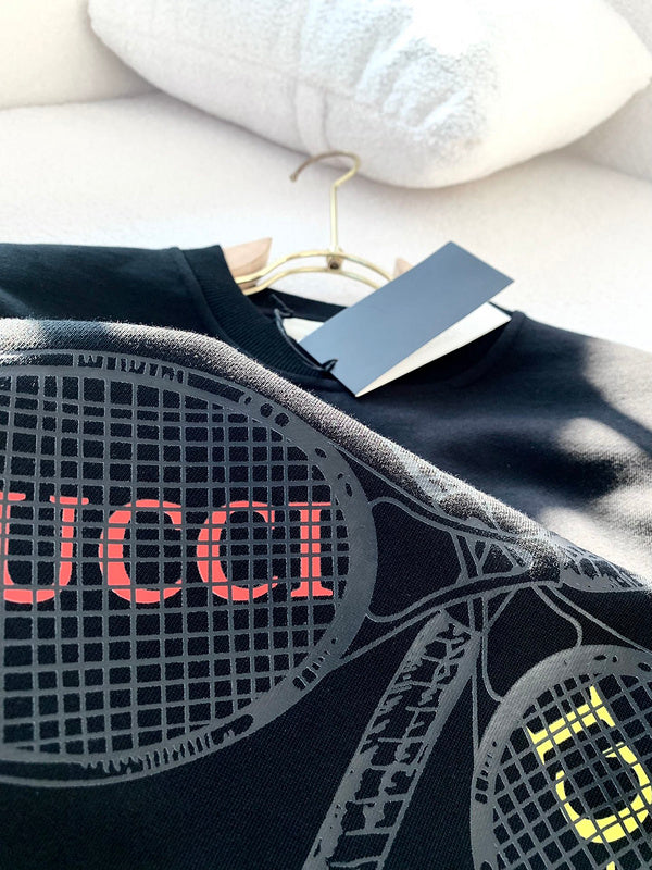 Close-up detail shot of Gucci luxury clothing with monogram-inspired silhouette