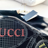 Close-up detail shot of Gucci luxury clothing with monogram-inspired silhouette