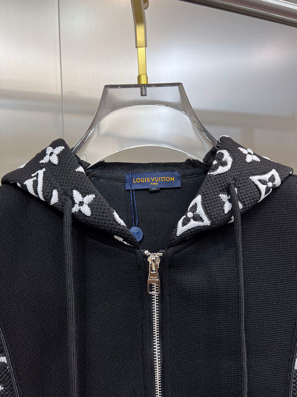 Close-up detail shot of Louis Vuitton luxury clothing with label-forward styling