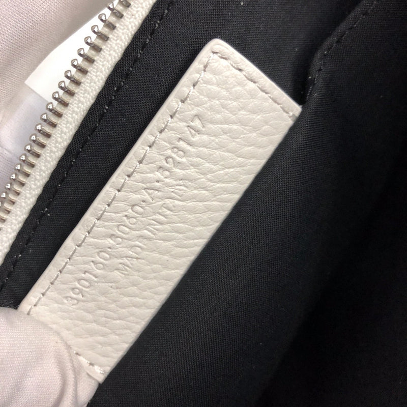 Side profile of chic statement women's handbag – women's everyday handbag