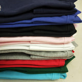 Close-up detail shot of Lacoste luxury clothing with monogram-inspired silhouette