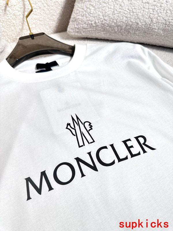 Close-up detail shot of Moncler luxury clothing with monogram-inspired silhouette