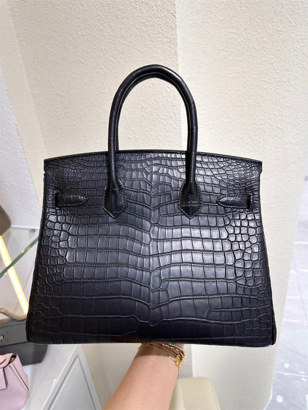  Refined carryall bag carried on shoulder 34