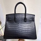  Refined carryall bag carried on shoulder 34