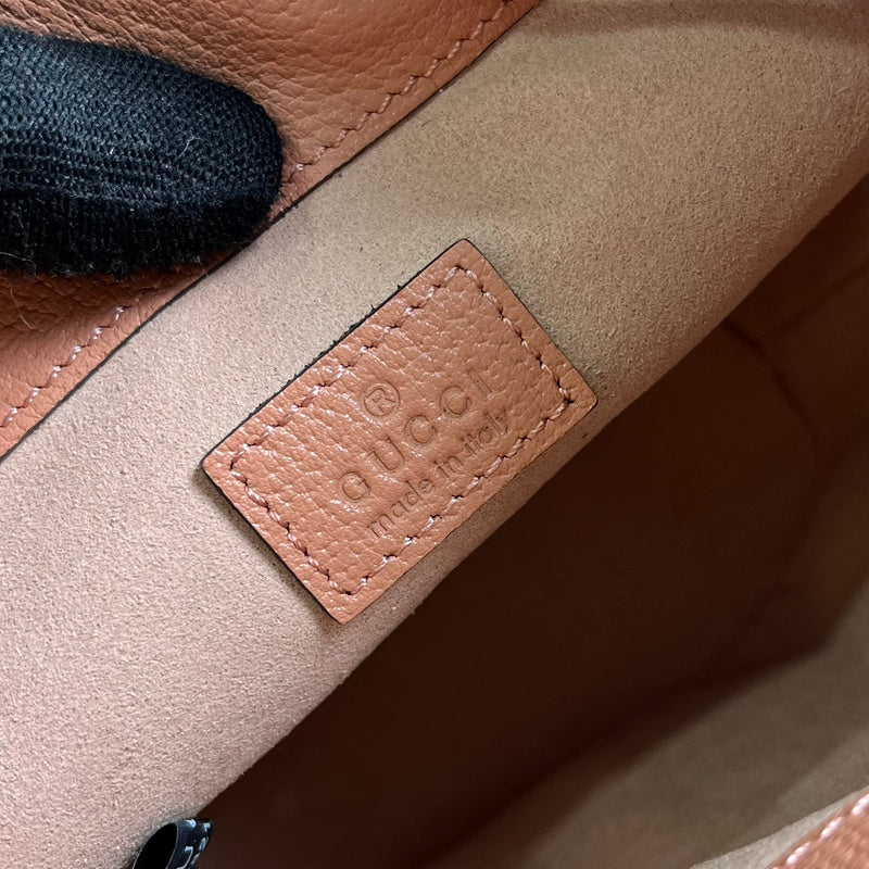 Styled lifestyle shot of refined signature women's handbag – women's statement bag