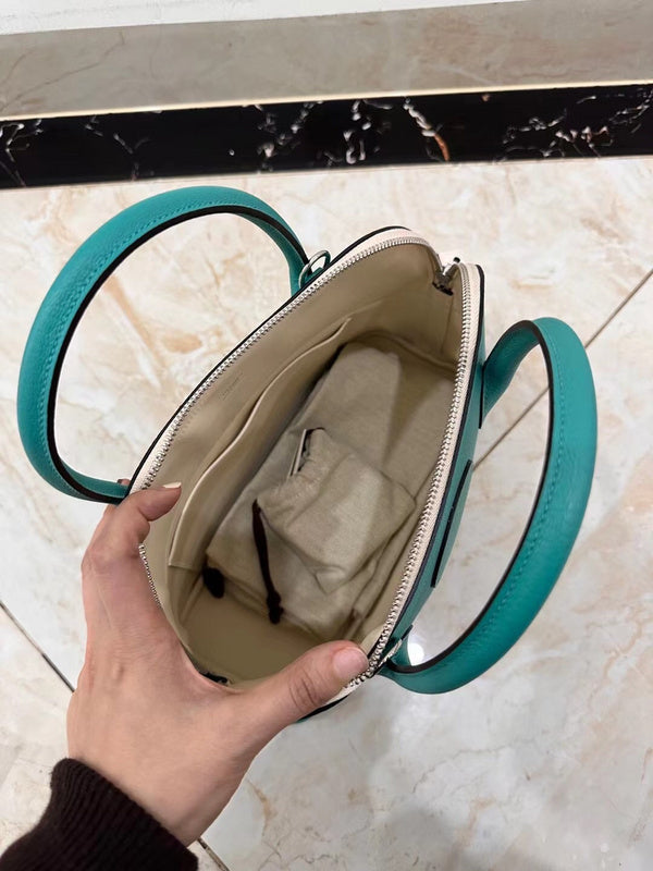 Side view of sleek structured handbag