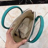 Side view of sleek structured handbag