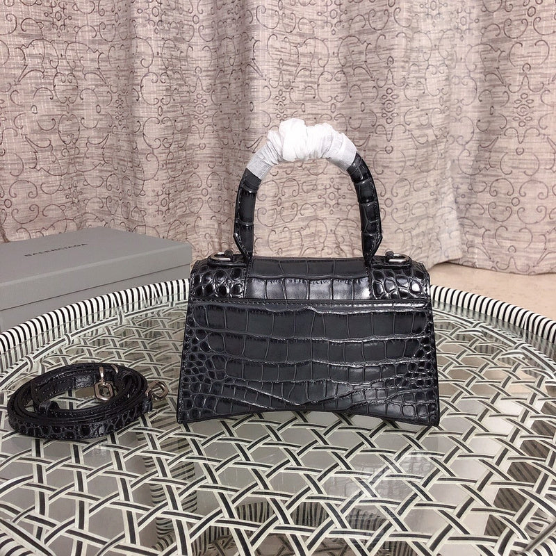 Styled lifestyle shot of everyday-luxe modern women's handbag – women's luxury handbag