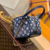 Side profile of signature structured women's handbag – women's statement bag
