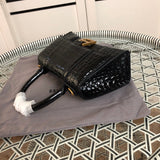 Styled lifestyle shot of refined premium women's handbag – women's everyday handbag