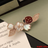 Angled view of Van Cleef & Arpels unisex jewelry piece