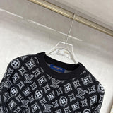 Flat lay presentation of Louis Vuitton luxury clothing with logo-detail design