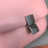 Styled lifestyle shot of modern structured women's handbag – women's statement bag