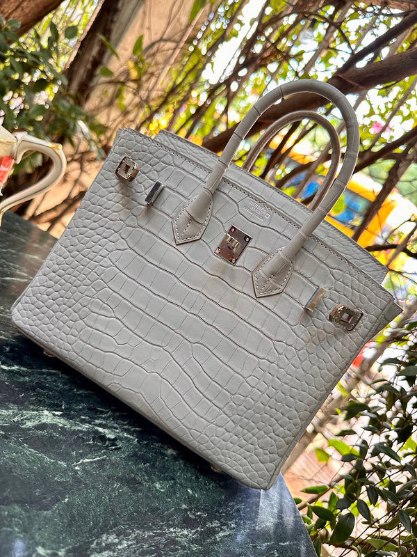 Side view of understated structured handbag