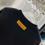 Side profile of Louis Vuitton luxury clothing with relaxed-fit cut