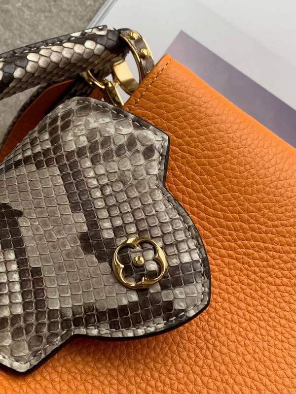 Handle and strap detail of modern refined women's handbag – women's designer-style accessory
