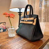 Side view of sculpted structured handbag