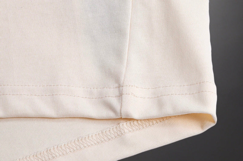 Close-up detail shot of Gucci luxury clothing with signature branding
