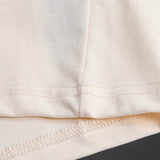 Close-up detail shot of Gucci luxury clothing with signature branding