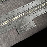 Side profile of refined chic women's handbag – women's statement bag