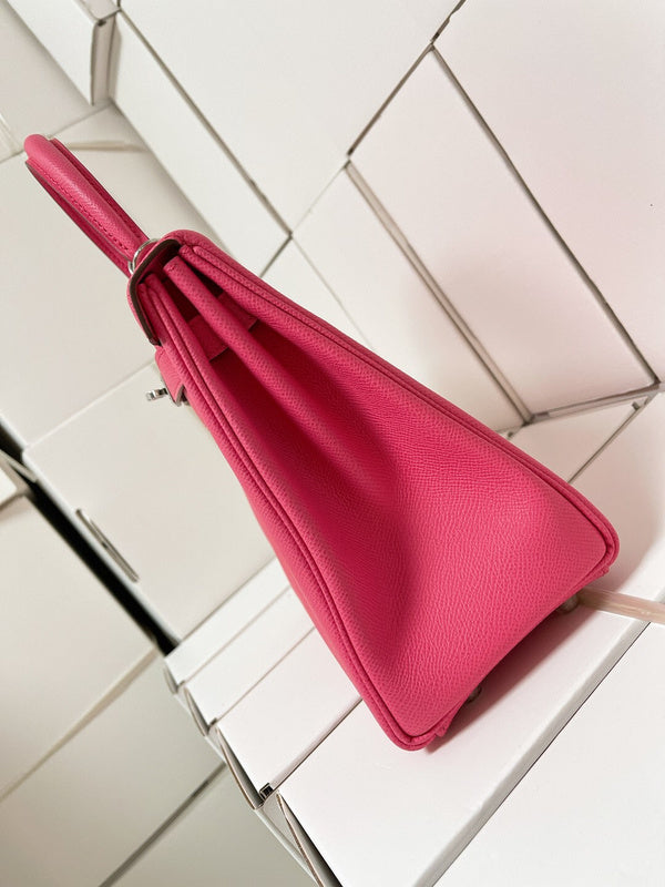 Side view of sculpted structured handbag