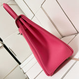 Side view of sculpted structured handbag