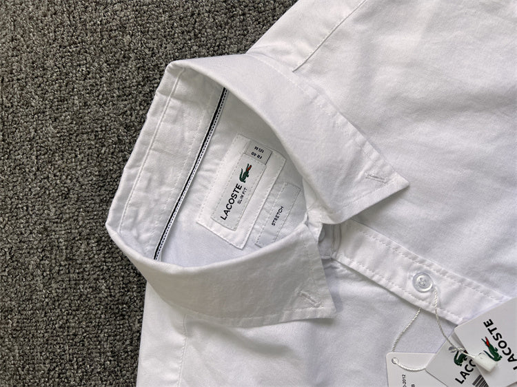 Flat lay presentation of Lacoste luxury clothing with logo-detail design