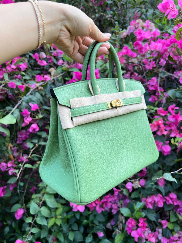 Side view of sculpted structured handbag