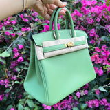 Side view of sculpted structured handbag