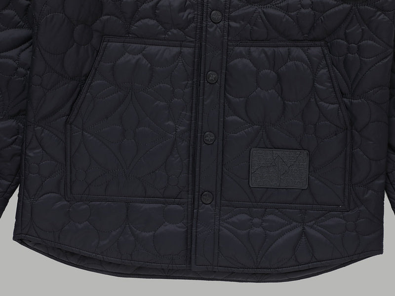 Flat lay presentation of Louis Vuitton luxury clothing with monogram-inspired silhouette