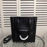 Front view of polished chic women's handbag – women's designer-style accessory