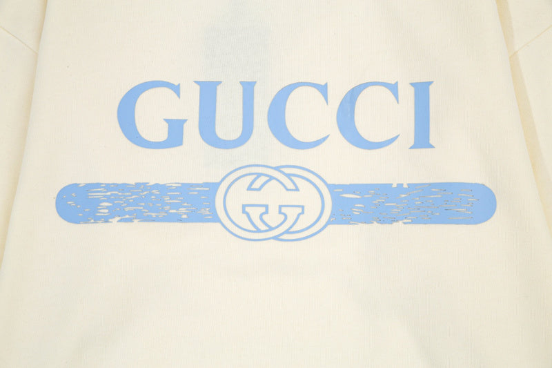 Flat lay presentation of Gucci luxury clothing with relaxed-fit cut