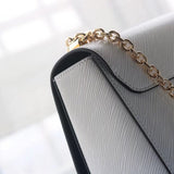 Front view of refined modern women's handbag – women's luxury accessory