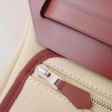 Side view of sculpted structured handbag