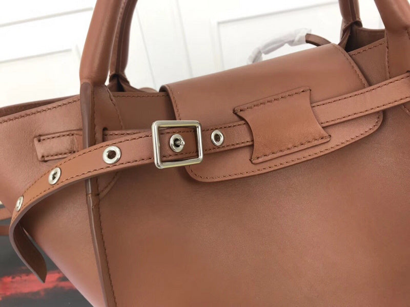 Handle and strap detail of modern signature women's handbag – women's designer-style accessory