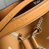 Handle and strap detail of structured polished women's handbag – women's everyday handbag