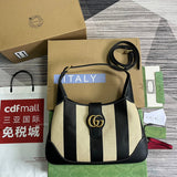 Side view of streamlined structured handbag