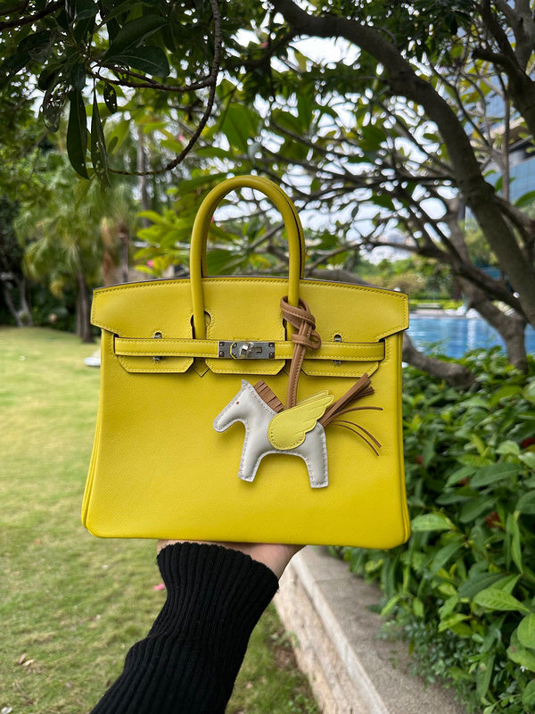 Side view of fluid structured handbag