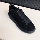 Alexander McQueen tonal black luxury sneakers view 8 classic court silhouette